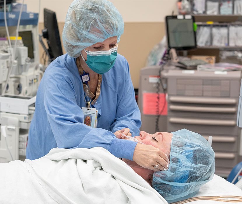 Medical professional assisting patient in training.